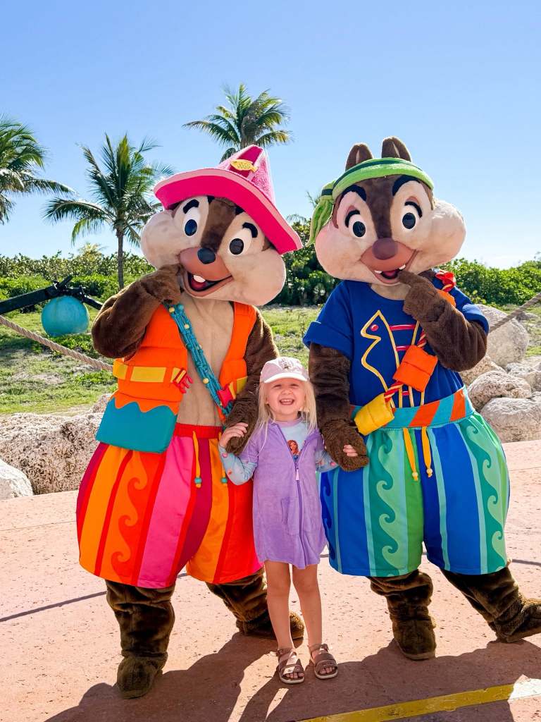 Small child with Chip and Dale at Disney's Lookout Cay